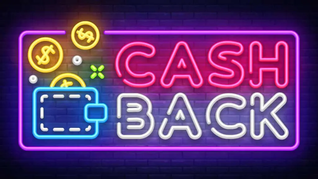 Neon cashback sign with glowing wallet and gold coins, purple and red text on a dark brick wall background.